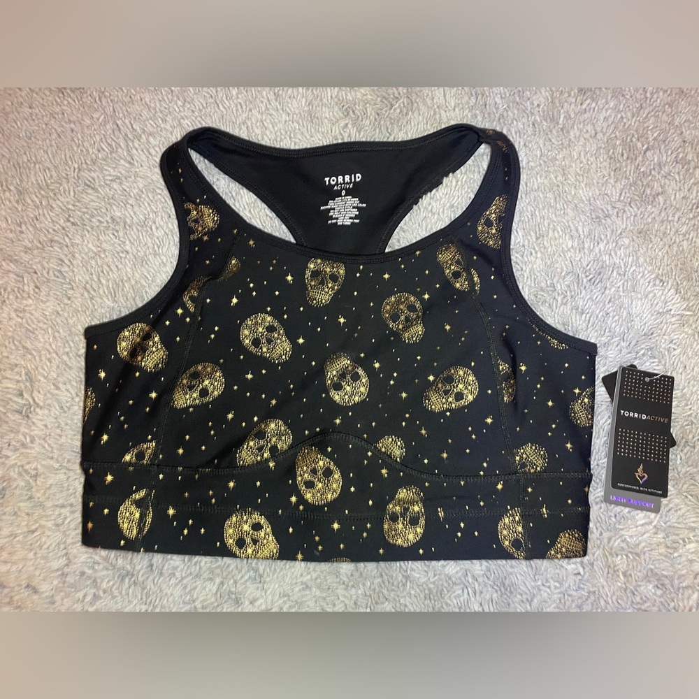 Torrid light support sports bra NWT size 0 Black with Gold Skulls